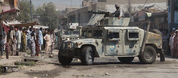 Afghan security forces inspect the site of a suicide attack in Jalalabad, east of Kabul, Afghanistan (File) - Sputnik International