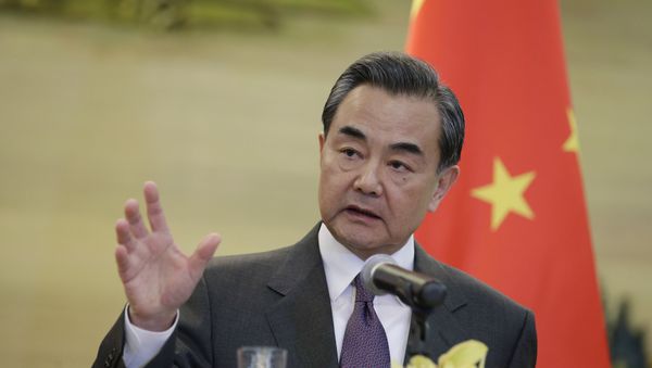 China's Foreign Minister Wang Yi speaks at a joint news conference with British Foreign Secretary Philip Hammond (not seen) after a meeting at the Ministry of Foreign Affairs, in Beijing, China, January 5, 2016 China's Foreign Minister Wang Yi speaks at a joint news conference with British Foreign Secretary Philip Hammond (not seen) after a meeting at the Ministry of Foreign Affairs, in Beijing, China, January 5, 2016 - Sputnik International