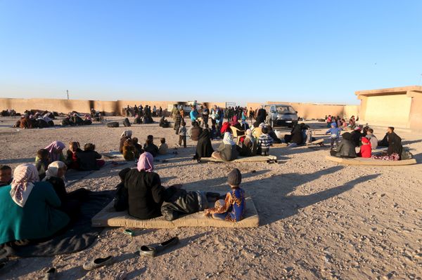 Displaced families, fleeing violence in Aleppo city and from Islamic State-controlled areas in Raqqa and Deir al-Zor, sit at a school in al-Mabroukeh village in the western countryside of Ras al-Ain, Syria December 28, 2015 - Sputnik International