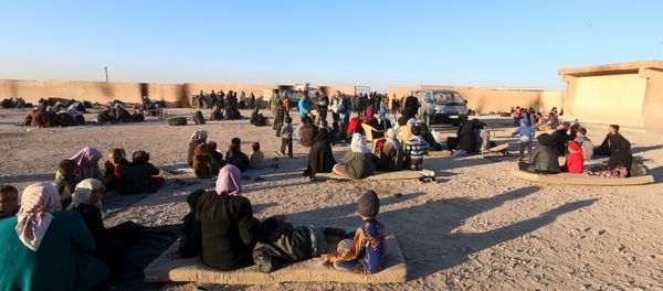Displaced families, fleeing violence in Aleppo city and from Islamic State-controlled areas in Raqqa and Deir al-Zor, sit at a school in al-Mabroukeh village in the western countryside of Ras al-Ain, Syria December 28, 2015 Displaced families, fleeing violence in Aleppo city and from Islamic State-controlled areas in Raqqa and Deir al-Zor, sit at a school in al-Mabroukeh village in the western countryside of Ras al-Ain, Syria December 28, 2015 - Sputnik International