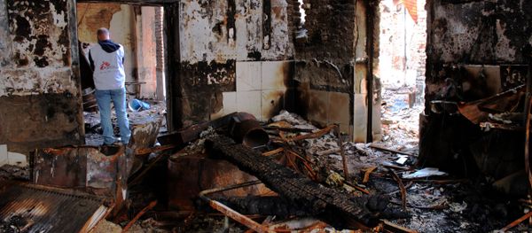 In this photograph taken on November 10 ,2015, Medecins Sans Frontieres (MSF) staff walk in the damaged Medecins Sans Frontieres (MSF) hospital in northern Kunduz - Sputnik International