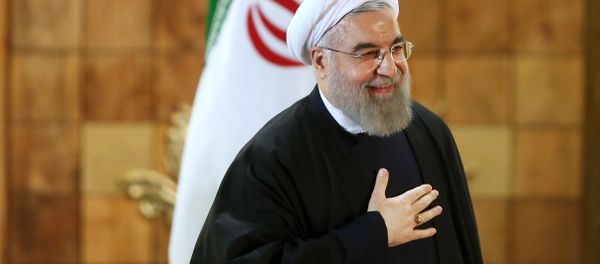 Iran's President Hassan Rouhani gestures at the conclusion of his press conference, in Tehran, Iran, Sunday, Jan. 17, 2016. The implementation of a historic nuclear deal with world powers is expected to pave the way for a new economic reality in Iran, now freed from harsh international sanctions Iran's President Hassan Rouhani gestures at the conclusion of his press conference, in Tehran, Iran, Sunday, Jan. 17, 2016. The implementation of a historic nuclear deal with world powers is expected to pave the way for a new economic reality in Iran, now freed from harsh international sanctions - Sputnik International