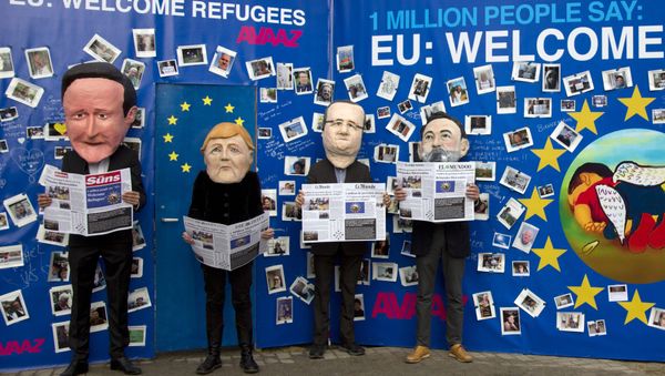 Actors dressed in EU leader face masks pose in front of a refugee message board during a demonstration in front a refugee message board outside of EU headquarters on Monday, Sept. 14, 2015. Actors dressed in EU leader face masks pose in front of a refugee message board during a demonstration in front a refugee message board outside of EU headquarters on Monday, Sept. 14, 2015. - Sputnik International