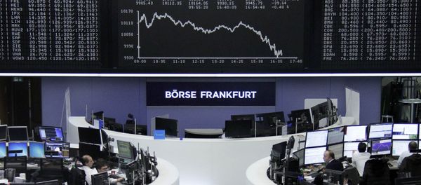 Traders work at their desks in front of the German share price index, DAX board, at the stock exchange in Frankfurt, Germany, January 13, 2016 Traders work at their desks in front of the German share price index, DAX board, at the stock exchange in Frankfurt, Germany, January 13, 2016 - Sputnik International