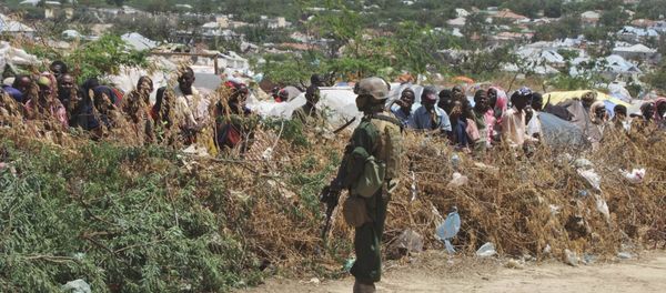A Somali soldier stands guard during a visit by Turkish Prime Minister Recep Tayyip Erdogan to a refugee camp in Mogadishu, Somalia to witness the famine in Somali capital Friday Aug. 19, 2011 A Somali soldier stands guard during a visit by Turkish Prime Minister Recep Tayyip Erdogan to a refugee camp in Mogadishu, Somalia to witness the famine in Somali capital Friday Aug. 19, 2011 - Sputnik International