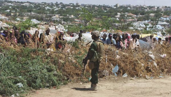 A Somali soldier stands guard during a visit by Turkish Prime Minister Recep Tayyip Erdogan to a refugee camp in Mogadishu, Somalia to witness the famine in Somali capital Friday Aug. 19, 2011 A Somali soldier stands guard during a visit by Turkish Prime Minister Recep Tayyip Erdogan to a refugee camp in Mogadishu, Somalia to witness the famine in Somali capital Friday Aug. 19, 2011 - Sputnik International
