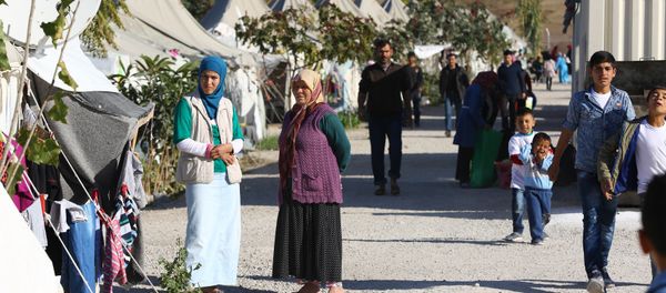 Syrian Refugees go about their daily lives at the Osmaniye refugee camp in Turkey on December 15, 2015 Syrian Refugees go about their daily lives at the Osmaniye refugee camp in Turkey on December 15, 2015 - Sputnik International