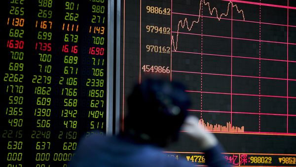 An investor looks at an electronic board displaying stock prices at a brokerage house in Beijing, Thursday, Jan. 14, 2016 An investor looks at an electronic board displaying stock prices at a brokerage house in Beijing, Thursday, Jan. 14, 2016 - Sputnik International