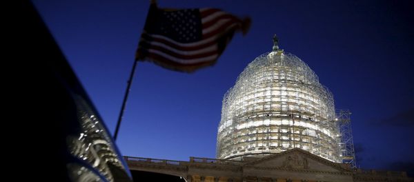 A U.S. flag on a vehicle flutters as the sun sets behind the U.S. Capitol dome in the hours before President Barack Obama delivers the State of the Union address to a joint session of Congress in Washington January 12, 2016 A U.S. flag on a vehicle flutters as the sun sets behind the U.S. Capitol dome in the hours before President Barack Obama delivers the State of the Union address to a joint session of Congress in Washington January 12, 2016 - Sputnik International