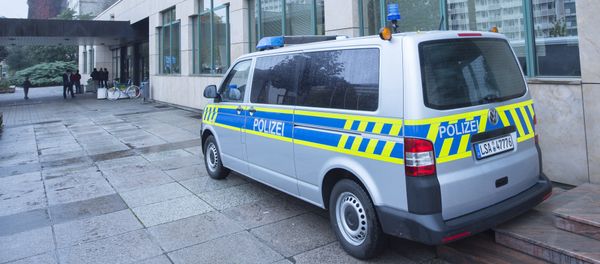 A police car stands in front of the initial reception center for asylum seekers in Halle/Saale, Germany, Friday, Oct. 16, 2015 A police car stands in front of the initial reception center for asylum seekers in Halle/Saale, Germany, Friday, Oct. 16, 2015 - Sputnik International
