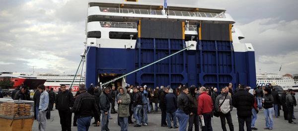 Communist-affiliated sailors and strike supporters gather on April 10, 2012 in front of a ferry at the port of Piraeus as Greek sailors began a two-day strike against government reforms Communist-affiliated sailors and strike supporters gather on April 10, 2012 in front of a ferry at the port of Piraeus as Greek sailors began a two-day strike against government reforms - Sputnik International