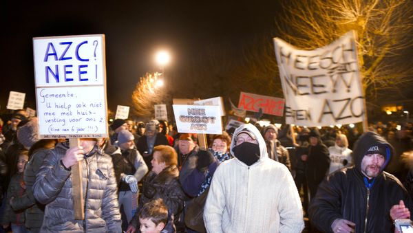 People gather to protest against the plans to open a refugee centre for 500 regufees in Heesch on January 18, 2016 People gather to protest against the plans to open a refugee centre for 500 regufees in Heesch on January 18, 2016 - Sputnik International