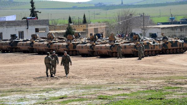 Turkish Army vehicles and tanks wait near the Syrian border in Suruc on February 23, 2015 Turkish Army vehicles and tanks wait near the Syrian border in Suruc on February 23, 2015 - Sputnik International