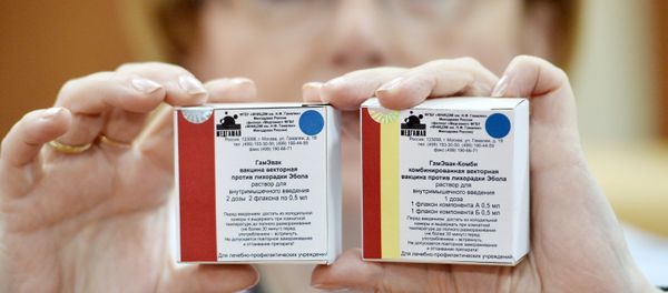 Russian Healthcare Minister Veronika Skvortsova demostrates Anti-Ebola fever vaccine packages at Gamalei Research Institute of Epidemiology and Microbiology - Sputnik International