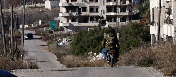 Syrian army soldiers ride a motorcycle in the village of Salma, in the northwestern province of Latakia on January 15, 2016 Syrian army soldiers ride a motorcycle in the village of Salma, in the northwestern province of Latakia on January 15, 2016 - Sputnik International