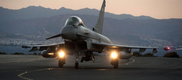 A British Royal Air Force Eurofighter Typhoon fighter jet is seen on the tarmac at the British airbase at Akrotiri, near Cyprus' second city of Limassol on December 3, 2015 - Sputnik International