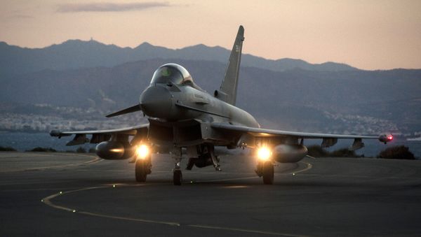 A British Royal Air Force Eurofighter Typhoon fighter jet is seen on the tarmac at the British airbase at Akrotiri, near Cyprus' second city of Limassol on December 3, 2015 - Sputnik International