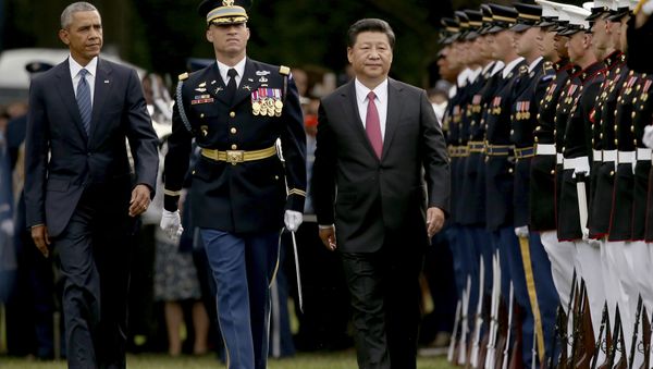 President Barack Obama and Chinese President Xi Jinping inspect the troops during an official state arrival ceremony for the Chinese president, Friday, Sept. 25, 2015, on the South Lawn of the White House in Washington. - Sputnik International