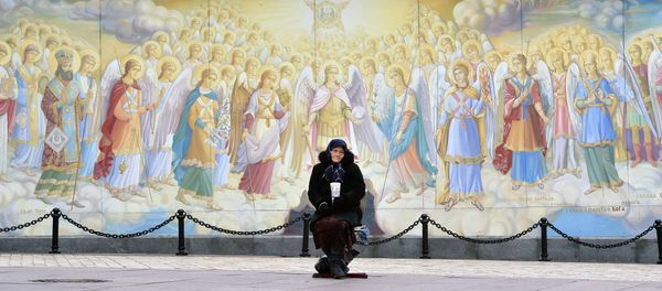An elderly woman asks for alms outside the Saint Michael Golden-Domed Monastery in Kiev An elderly woman asks for alms outside the Saint Michael Golden-Domed Monastery in Kiev - Sputnik International