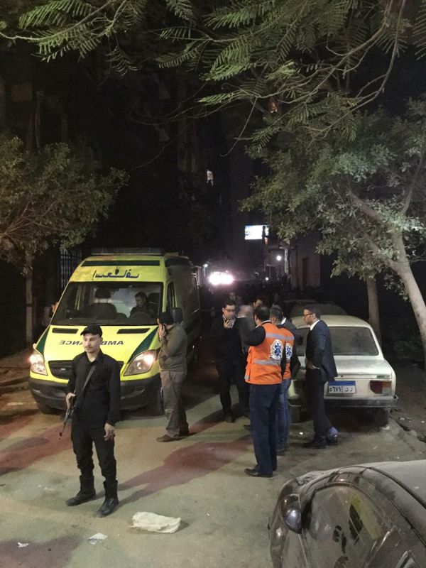 First responders and security personnel stand outside of a Cairo apartment where a bomb exploded. - Sputnik International