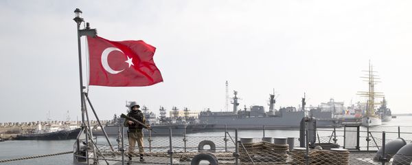 A Turkish marine serviceman stands on the deck of a Turkish navy TCG Turgutreis vessel - Sputnik International
