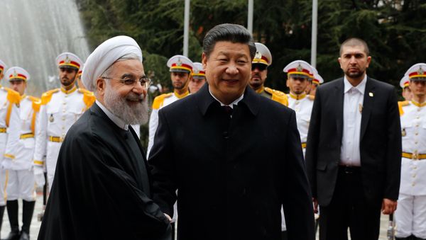 Iranian President Hassan Rouhani shakes hands with Chinese President Xi Jinping (R) during a welcoming ceremony on January 23, 2016 in the capital Tehran. Iranian President Hassan Rouhani shakes hands with Chinese President Xi Jinping (R) during a welcoming ceremony on January 23, 2016 in the capital Tehran. - Sputnik International