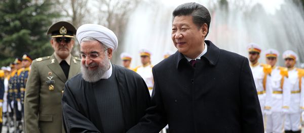 Chinese President Xi Jinping, right, shakes hands with Iranian President Hassan Rouhani in an official arrival ceremony, at the Saadabad Palace in Tehran, Iran, Saturday, Jan. 23, 2016. - Sputnik International