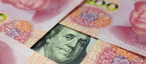 A US 100-dollar banknote with a portrait of Benjamin Franklin and Chinese 100-yuan banknotes with portrait of late Chinese Chairman Mao Zedong are seen in the picture illustration in Beijing, China - Sputnik International
