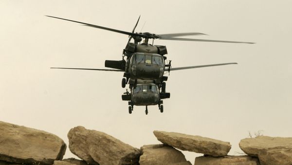 Two US military Black Hawk helicopters take off from its compound in the northern Iraqi city of Mosul (file photo) - Sputnik International
