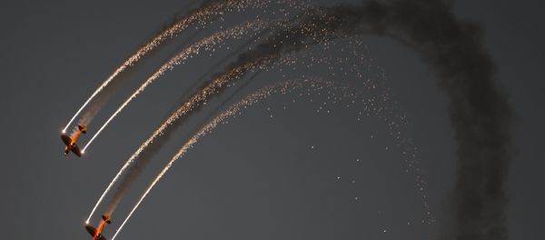 DHL's Twisters & Extra 300 perform during the second day of the Bahrain Air Show 2016 at Sakhir, south of Bahrain January 22, 2016. DHL's Twisters & Extra 300 perform during the second day of the Bahrain Air Show 2016 at Sakhir, south of Bahrain January 22, 2016. - Sputnik International