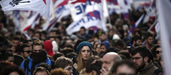 Supporters of the Communist-affiliated union PAME participate in a rally opposing planned reforms in the country's pension system in Athens, on Saturday, Jan. 23, 2016. - Sputnik International