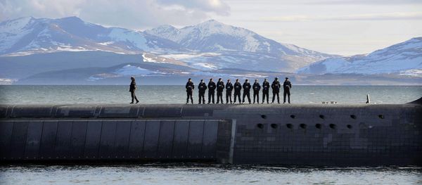 British Navy personnel stand atop the Trident Nuclear Submarine, HMS Victorious, on patrol off the west coast of Scotland British Navy personnel stand atop the Trident Nuclear Submarine, HMS Victorious, on patrol off the west coast of Scotland - Sputnik International