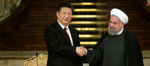Iranian President Hassan Rouhani, right, and his Chinese counterpart Xi Jinping shake hands at the conclusion of their joint press conference at the Saadabad Palace in Tehran, Iran, Saturday, Jan. 23, 2016 Iranian President Hassan Rouhani, right, and his Chinese counterpart Xi Jinping shake hands at the conclusion of their joint press conference at the Saadabad Palace in Tehran, Iran, Saturday, Jan. 23, 2016 - Sputnik International