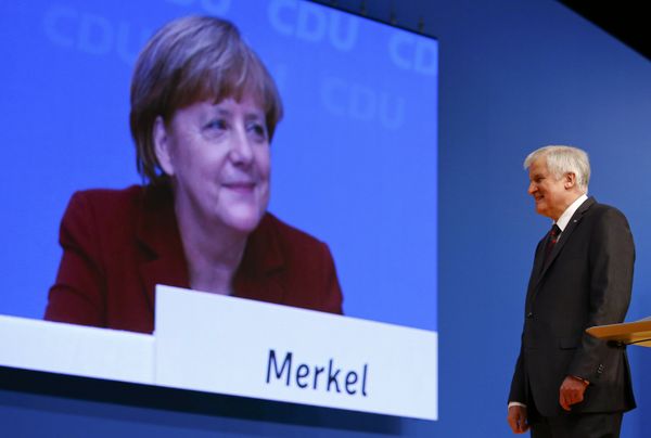 German Chancellor and leader of the Christian Democratic Union (CDU) Angela Merkel is seen on a video screen as Bavarian Prime Minister and head of the Christian Social Union (CSU) Horst Seehofer makes a speech at the CDU party congress in Karlsruhe, Germany in this December 15, 2015. - Sputnik International