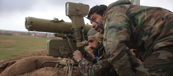 Syrian pro-government forces adjust a man-portable anti-tank system as they hold a position during a military operation against Daesh militants Syrian pro-government forces adjust a man-portable anti-tank system as they hold a position during a military operation against Daesh militants - Sputnik International
