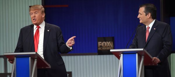 Republican Presidential candidate businessman Donald Trump (L) speaks next to Texas Senator Ted Cruz during the Republican Presidential debate sponsored by Fox Business and the Republican National Committee at the North Charleston Coliseum and Performing Arts Center in Charleston, South Carolina on January 14, 2016 Republican Presidential candidate businessman Donald Trump (L) speaks next to Texas Senator Ted Cruz during the Republican Presidential debate sponsored by Fox Business and the Republican National Committee at the North Charleston Coliseum and Performing Arts Center in Charleston, South Carolina on January 14, 2016 - Sputnik International