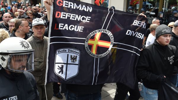 Right-extremists and hooligans take part in a rally of the initiative Widerstand Ost/West (Resistance East/West, WOW), a union of right-wing nationalists, Islamophobes and hooligans, on June 20, 2015 in Frankfurt am Main, western Germany Right-extremists and hooligans take part in a rally of the initiative Widerstand Ost/West (Resistance East/West, WOW), a union of right-wing nationalists, Islamophobes and hooligans, on June 20, 2015 in Frankfurt am Main, western Germany - Sputnik International