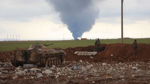Syrian pro-government forces hold a position as smoke billows following an air strike on Daesh militants' position in the Hatabat al-Bab area, near town of Al-Bab in Aleppo's eastern countryside, on January 24, 2016 Syrian pro-government forces hold a position as smoke billows following an air strike on Daesh militants' position in the Hatabat al-Bab area, near town of Al-Bab in Aleppo's eastern countryside, on January 24, 2016 - Sputnik International