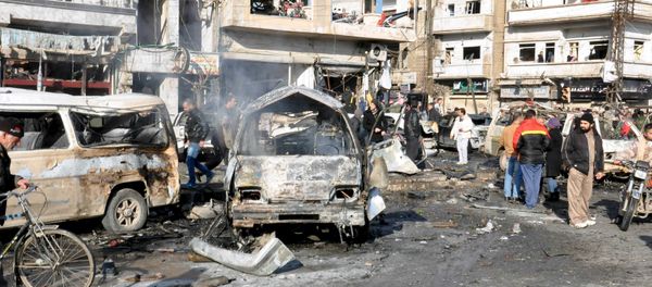People inspect the site of a double bomb attack in the government-controlled city of Homs, Syria, in this handout picture provided by SANA on January 26, 2016 People inspect the site of a double bomb attack in the government-controlled city of Homs, Syria, in this handout picture provided by SANA on January 26, 2016 - Sputnik International