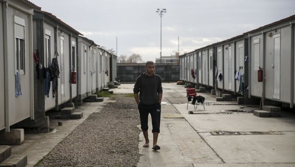 A refugee walks inside the Eleonas refugee camp in Athens, Greece, January 5, 2016 A refugee walks inside the Eleonas refugee camp in Athens, Greece, January 5, 2016 - Sputnik International