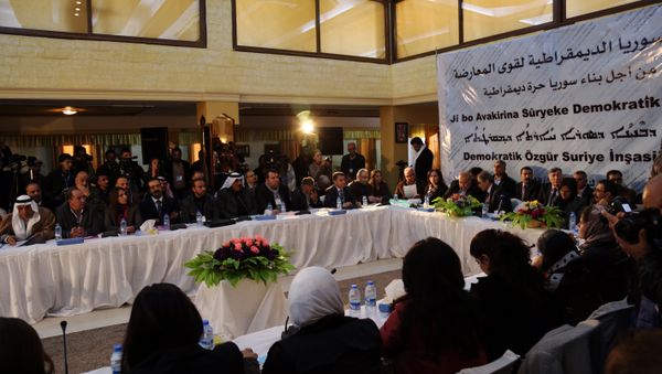 A picture taken on December 8, 2015 shows a general view of the two-day Syrian Democratic Conference in Al-Malikiyeh, a town in Syria's northeastern Hasakeh province, held by Kurdish factions to discuss a vision for Syria's future. Dozens of Kurdish, Arab, and Assyrian figures attended the conference including members of Syria's leading Kurdish movement, the Democratic Union Party (PYD), A picture taken on December 8, 2015 shows a general view of the two-day Syrian Democratic Conference in Al-Malikiyeh, a town in Syria's northeastern Hasakeh province, held by Kurdish factions to discuss a vision for Syria's future. Dozens of Kurdish, Arab, and Assyrian figures attended the conference including members of Syria's leading Kurdish movement, the Democratic Union Party (PYD), - Sputnik International