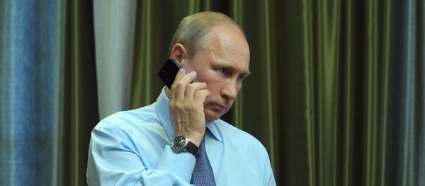 President Vladimir Putin talks over the phone President Vladimir Putin talks over the phone - Sputnik International