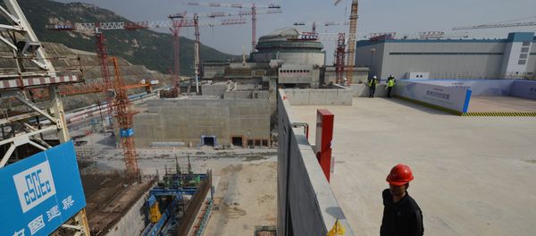 Workers wait for French Prime Minister Jean-Marc Ayrault to arrive at the joint Sino-French Taishan Nuclear Power Station outside Taishan City in Guandong province on December 8, 2013 Workers wait for French Prime Minister Jean-Marc Ayrault to arrive at the joint Sino-French Taishan Nuclear Power Station outside Taishan City in Guandong province on December 8, 2013 - Sputnik International