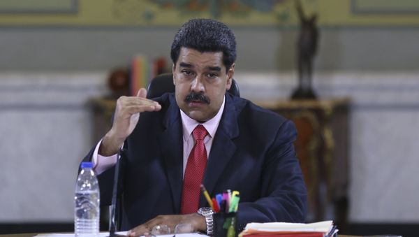 Venezuela's President Nicolas Maduro speaks during a meeting with deputies of Venezuela's United Socialist Party (PSUV) and ministers at Miraflores Palace in Caracas, in this handout picture provided by Miraflores Palace on January 22, 2016 - Sputnik International