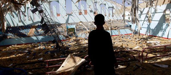 A Yemeni boy inspect the damage at a sports hall that was partially destroyed by Saudi-led air strikes in the Yemeni capital Sanaa on January 19, 2016. A Yemeni boy inspect the damage at a sports hall that was partially destroyed by Saudi-led air strikes in the Yemeni capital Sanaa on January 19, 2016. - Sputnik International