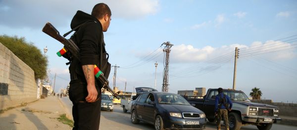 Members of the Kurdish internal security forces (known as the Asayish) check vehicles on December 16, 2015 in the northeastern Syrian city of Qamishli as tensions rose between regime forces and Kurdish fighter in the city Members of the Kurdish internal security forces (known as the Asayish) check vehicles on December 16, 2015 in the northeastern Syrian city of Qamishli as tensions rose between regime forces and Kurdish fighter in the city - Sputnik International
