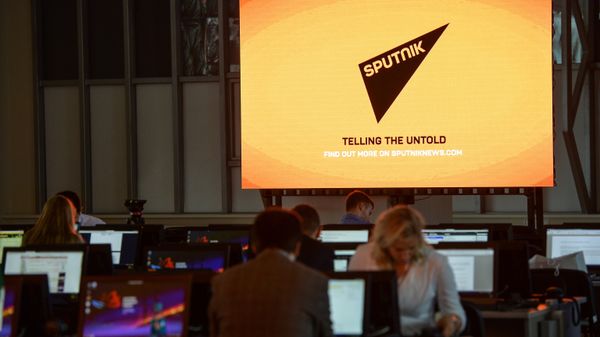 A screen featuring the logo of the Sputnik International News Agency and Radio seen at the media center of the Eastern Economic Forum, Vladivostok - Sputnik International