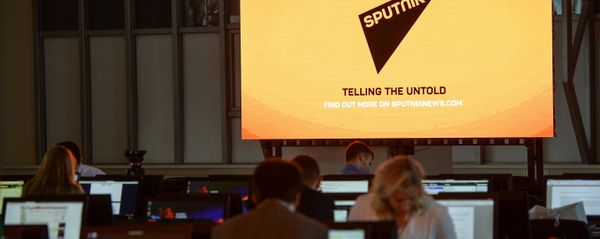 A screen featuring the logo of the Sputnik International News Agency and Radio seen at the media center of the Eastern Economic Forum, Vladivostok - Sputnik International