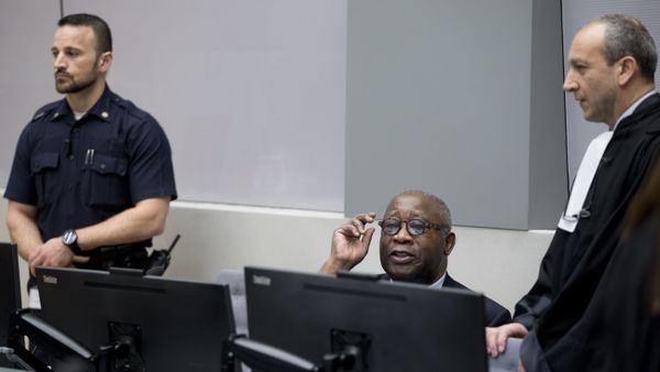 Former Ivory Coast president Laurent Gbagbo (C) and his lawyer Emmanuel Altit (R) wait for the start of his trial at the International Criminal Court in The Hague on January 28, 2016 - Sputnik International