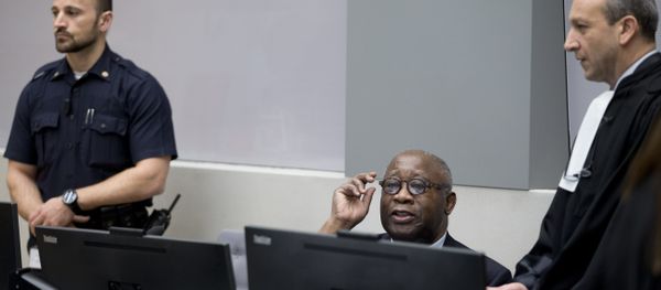 Former Ivory Coast president Laurent Gbagbo (C) and his lawyer Emmanuel Altit (R) wait for the start of his trial at the International Criminal Court in The Hague on January 28, 2016 Former Ivory Coast president Laurent Gbagbo (C) and his lawyer Emmanuel Altit (R) wait for the start of his trial at the International Criminal Court in The Hague on January 28, 2016 - Sputnik International